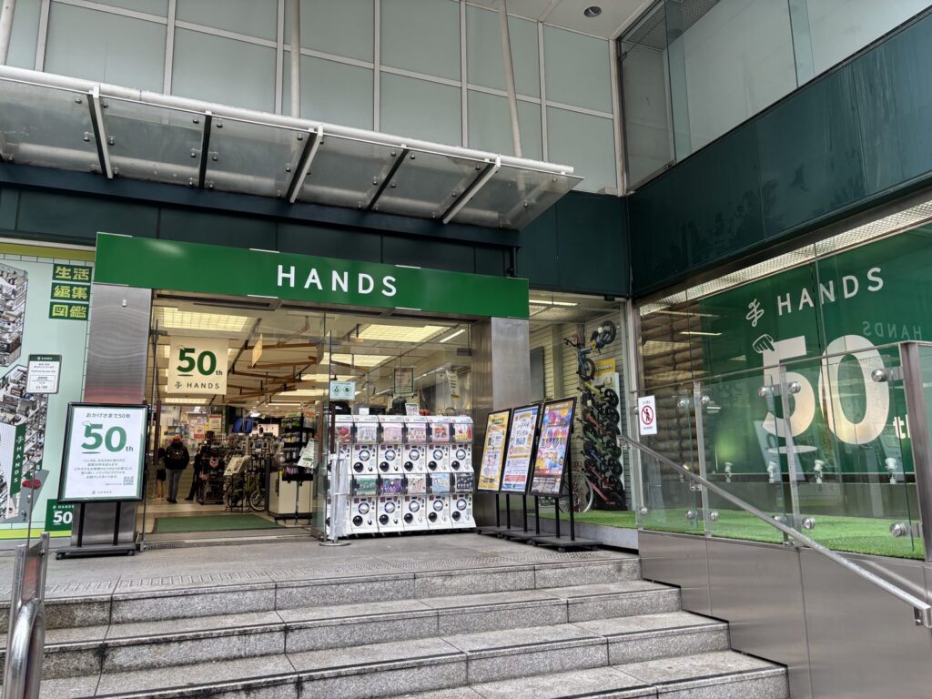 Hands Shibuya storefront with green signage and 50th anniversary banner