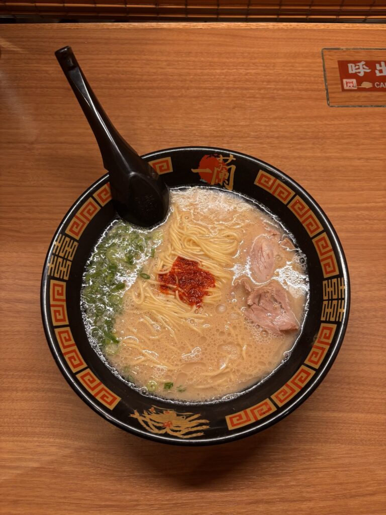 Ichiran tonkotsu ramen bowl with signature spicy red sauce and chashu pork