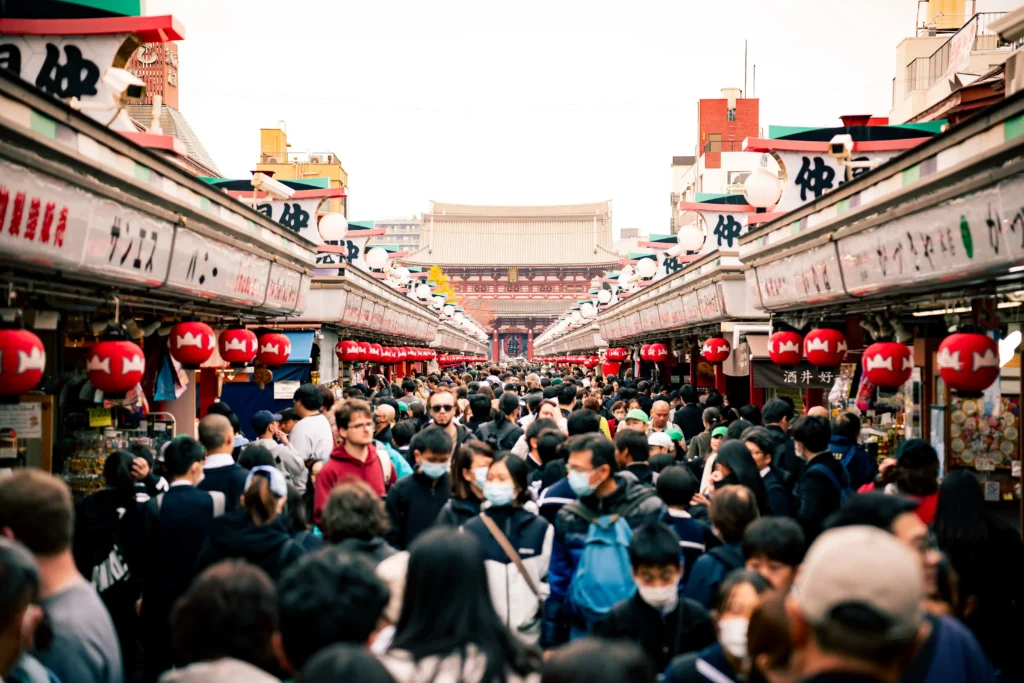 Crowded Nakamise shopping street leading to Sensoji Temple in Asakusa, Tokyo.