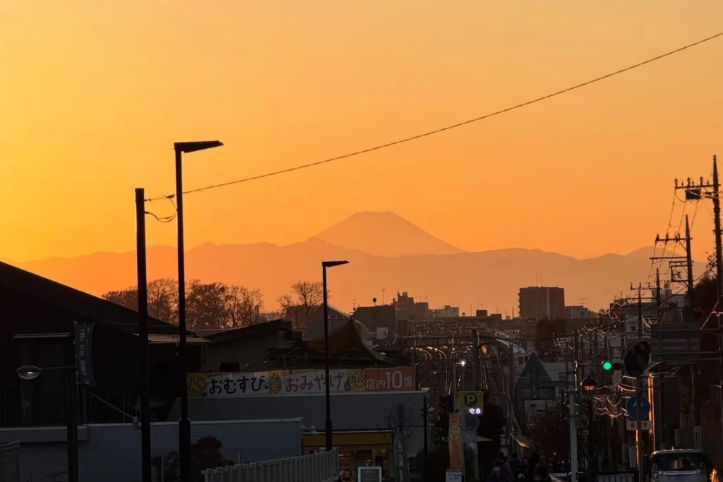 Silhouette of Mount Fuji at sunset viewed from the streets of Setagaya-Daita, near Shimokitazawa.