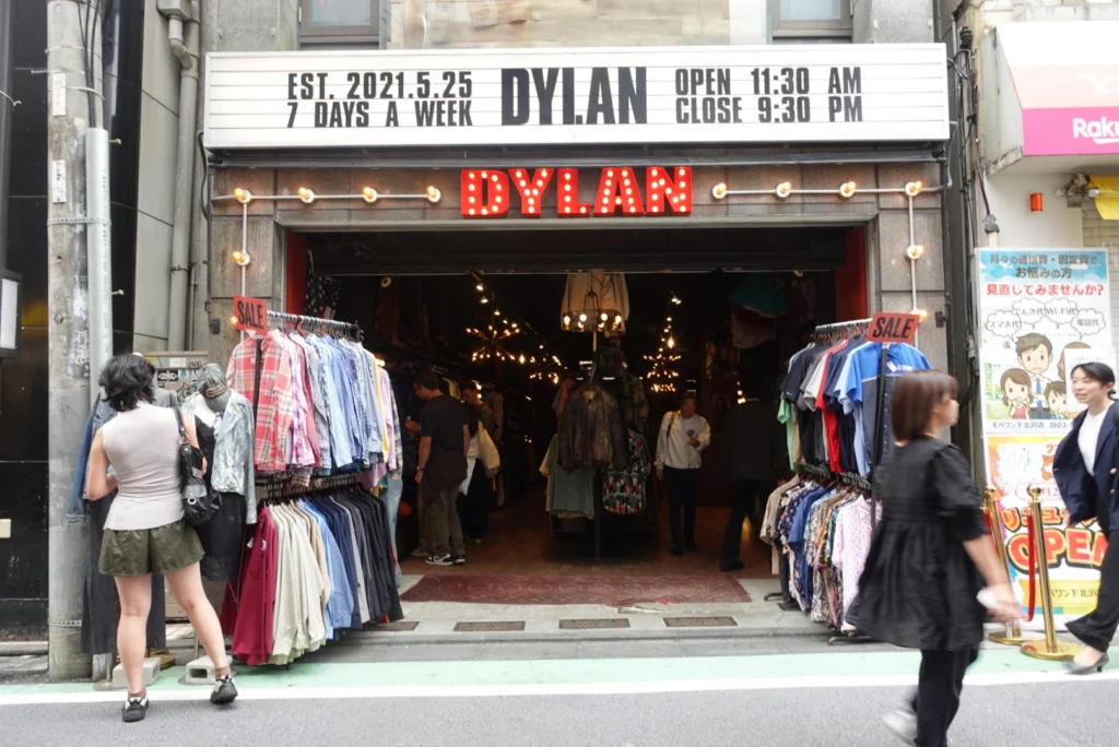 Shoppers browsing racks of vintage clothing outside the Dylan thrift store in Shimokitazawa, Tokyo.